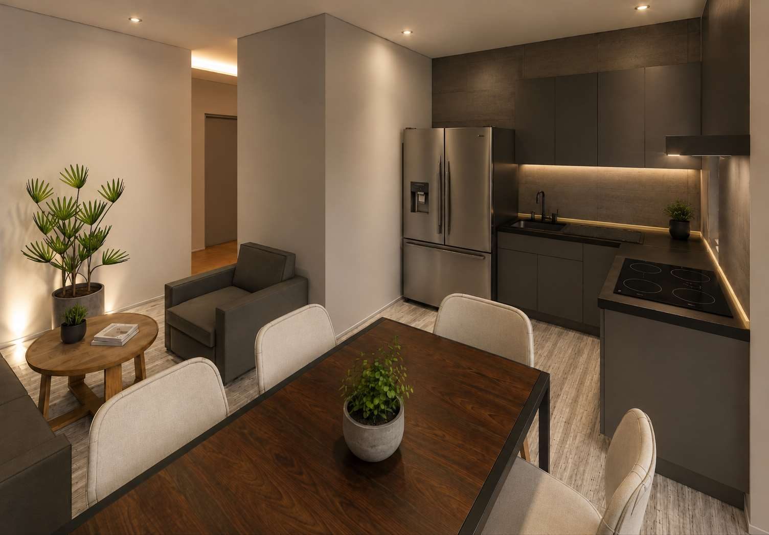 Cocina abierta con comedor, muebles oscuros y luz cálida